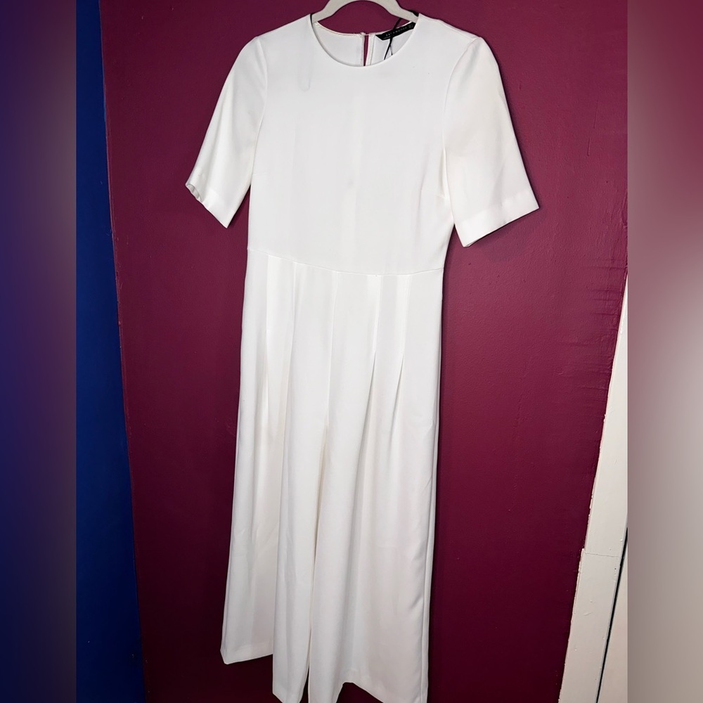 Zara white jumpsuit with short sleeves and pleated pants
